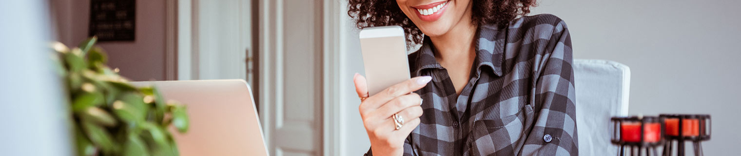 Woman looking at phone at home