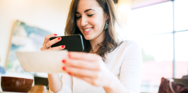 Woman using phone to deposit check