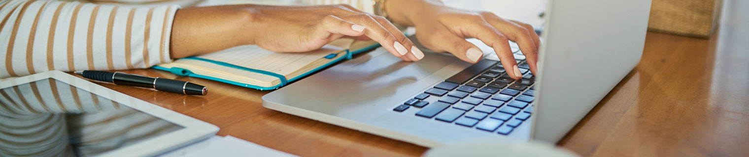 Woman typing on laptop